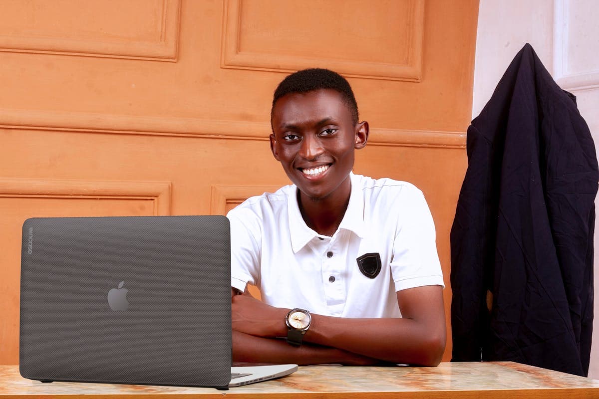 A Cameroonian developer coding on a laptop — computer science studies and careers in Cameroon