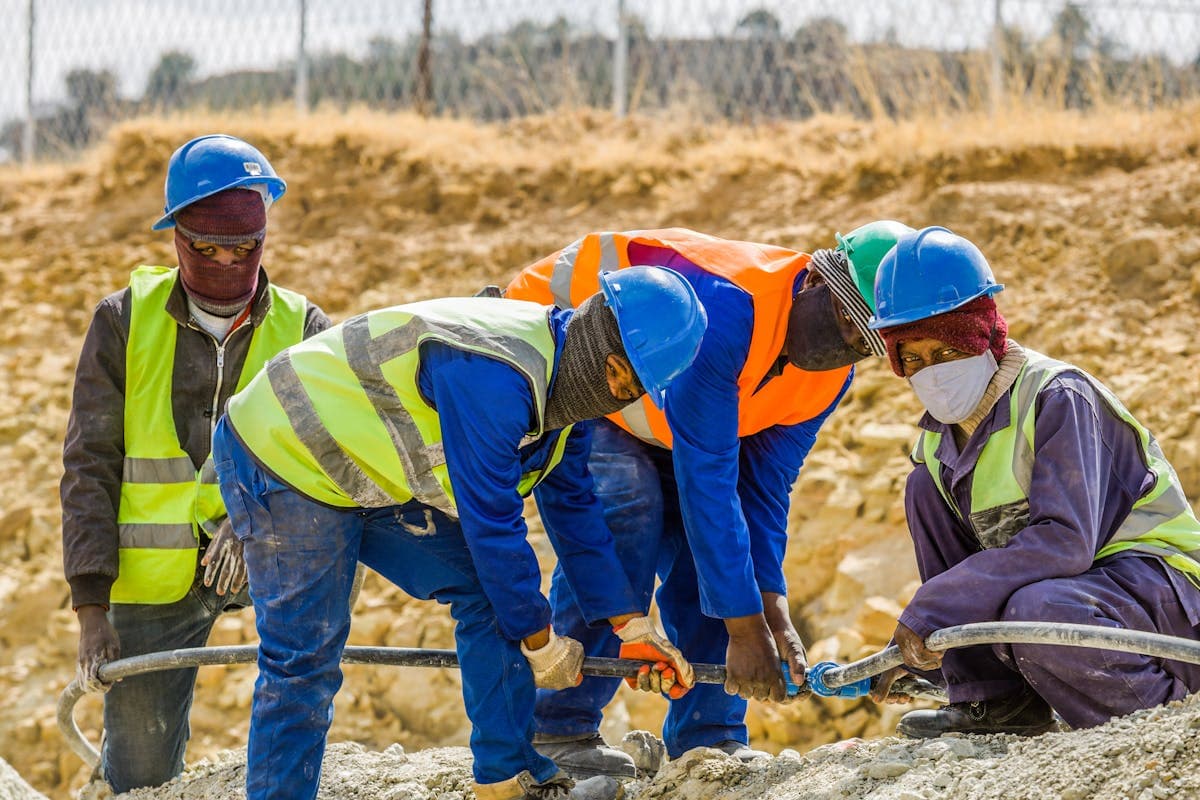 A Cameroonian apprentice in vocational training — welding, plumbing, IT